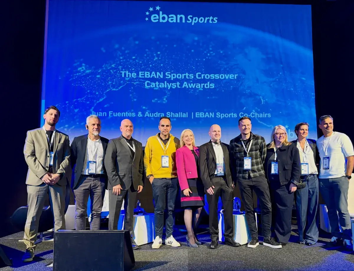 Håkon Ege on stage with jury members and participants at the EBAN Sports event.