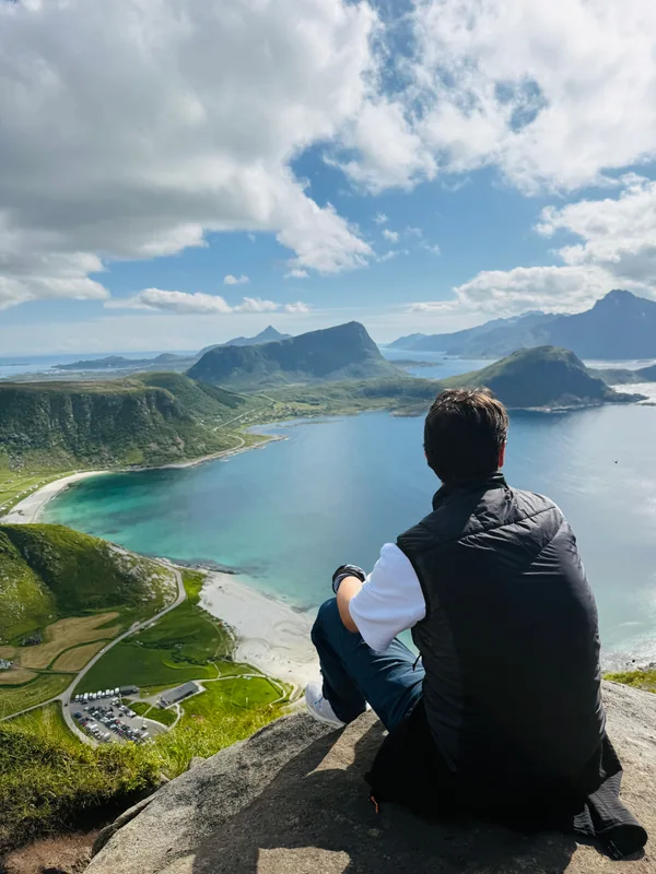 Håkon Ege looking out over a mountain landscape.